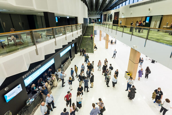 View of conference delegates mingling in Convention Centre foyer