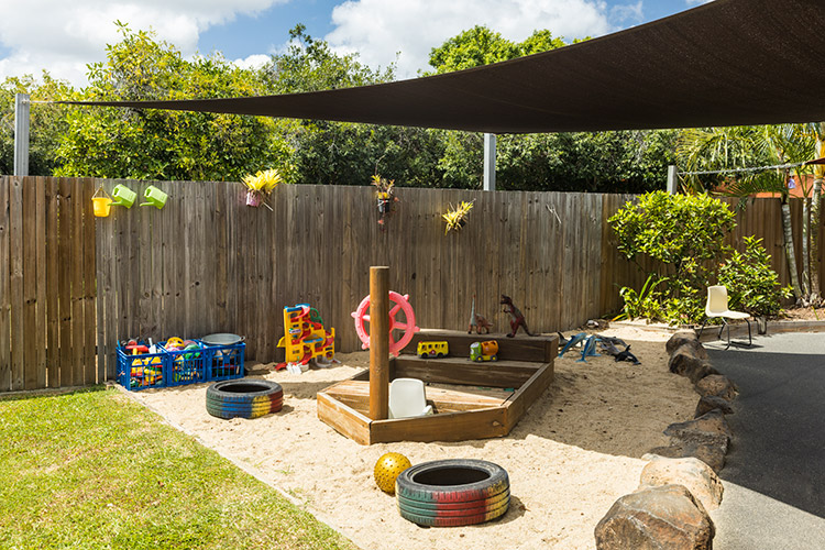 Sandpit with wooden ship in an early learning centre