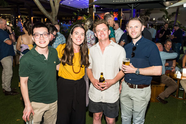 Group photo of delegates at conference social event at bar