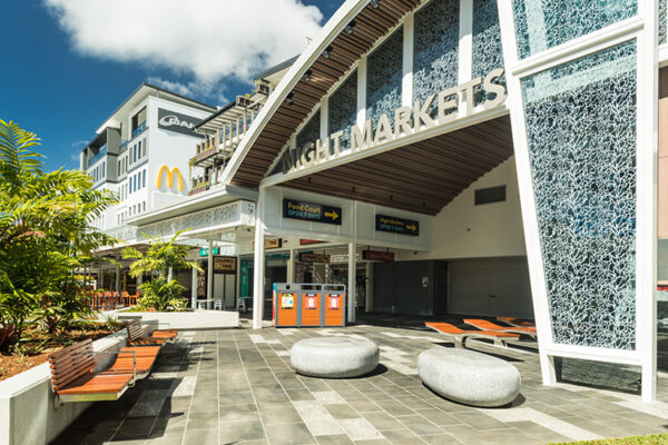 Entrance of Night Markets building featuring seating and paved areas