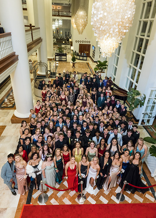 Group photo of all students at school senior formal in hotel foyer