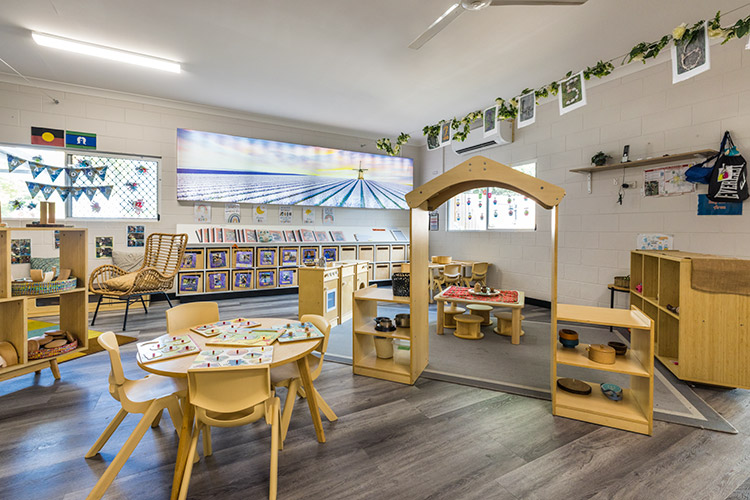 A childcare centre learning space with games, books and tables