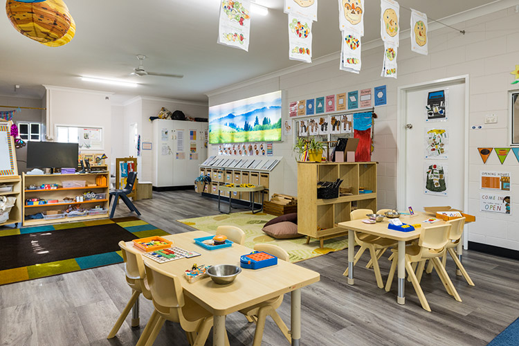 An early learning centre classroom with tables, games and books