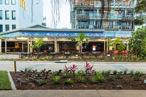 Tropical landscaping and cafe seating along the Esplanade waterfront precinct