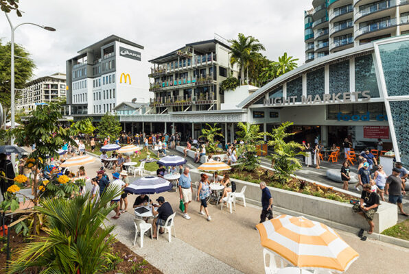 People walking and seated along Esplanade promenade