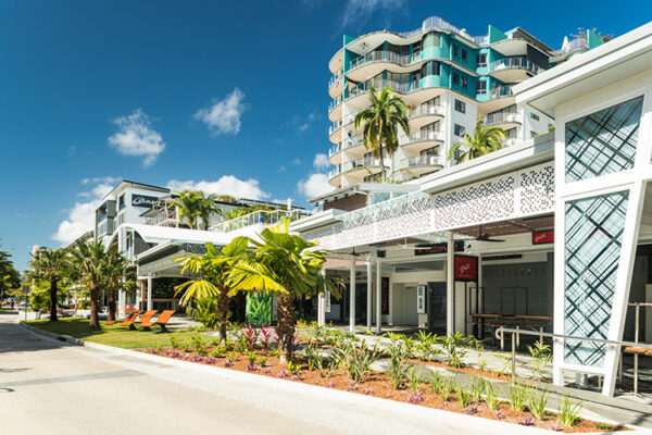 Tropical landscaping and cafe seating along the Esplanade waterfront precinct