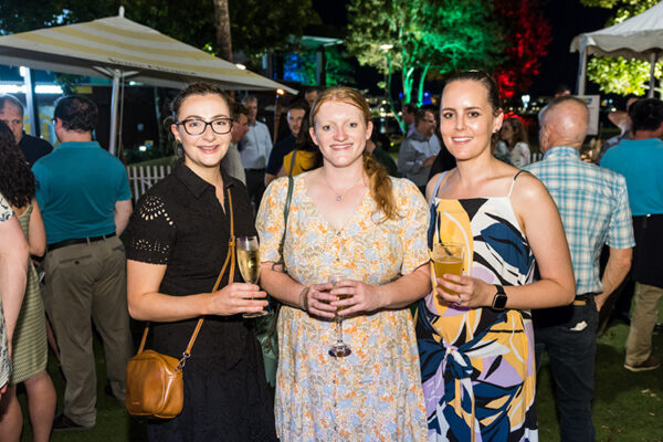 Group photo of delegates at conference social event at bar