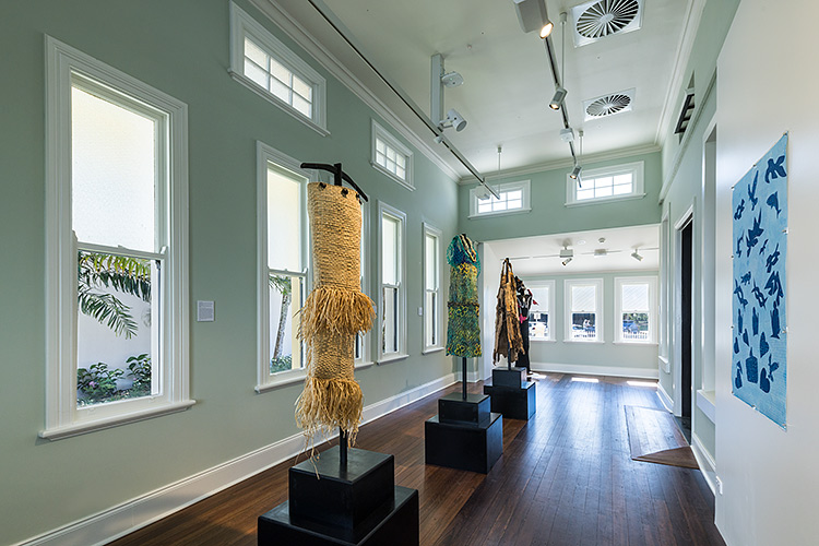 Dresses and artworks on display in the Mulgrave Gallery art spaces