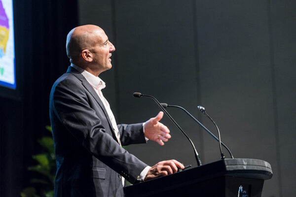 Male speaker at conference lectern